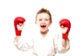 Martial art sport - smiling karate champion child boy gesturing for victory triumph
